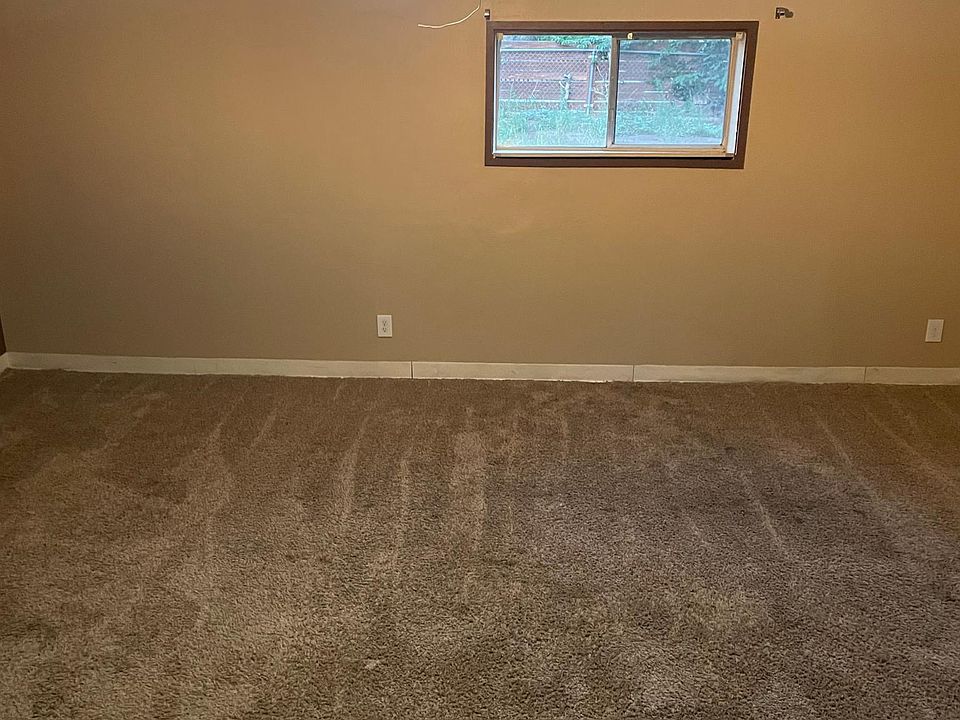 The large room in the back (16x18) that can be used as a bedroom or family room.