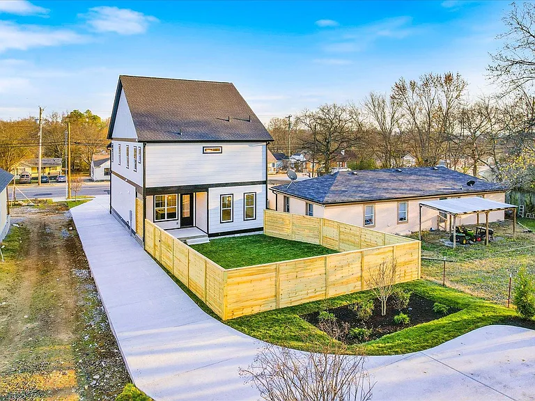 Fully fenced back yard with covered patio