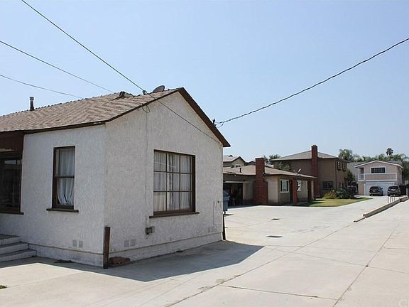House is located on a long lot, is the third house back from