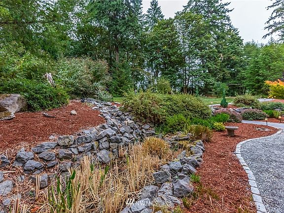 Wander the property to find a babbling fountain, huge grassy lawns, old growth trees-an outdoor paradise