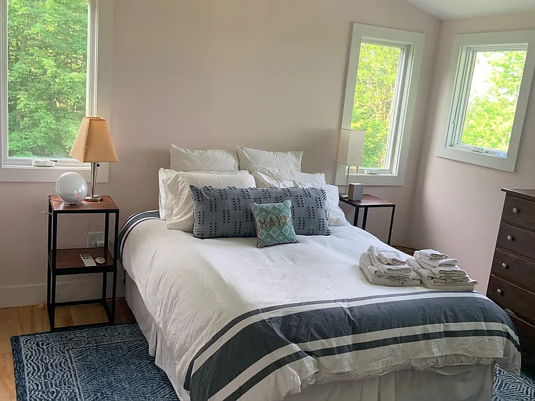 Master bedroom with high ceilings and a heat pump/AC. Westerly views of the Adirondacks