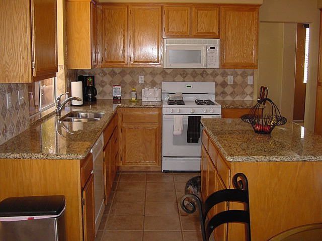 Granite 270 degree countertop and lots of cabinets