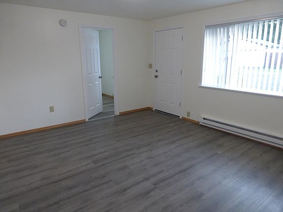 Large front living room and door to smaller second bedroom.