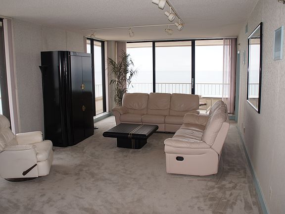 Spacious living room with all glass gives panoramic views