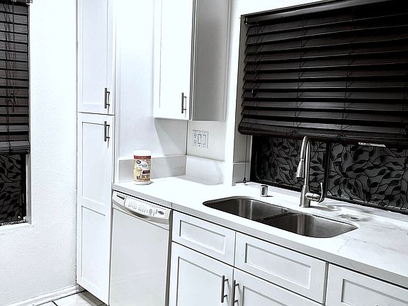 Kitchen: New counter tops, New sink and faucet. New Cabinets.