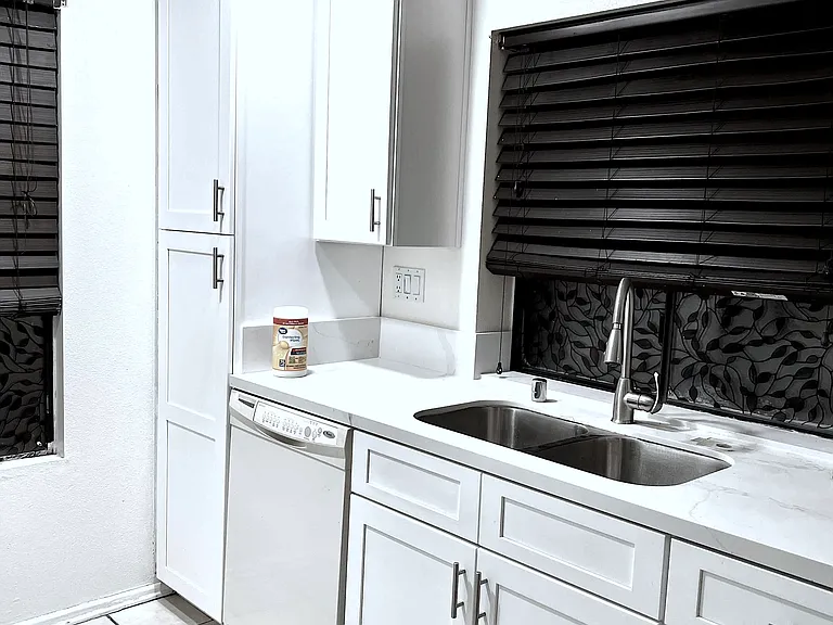 Kitchen: New counter tops, New sink and faucet. New Cabinets.