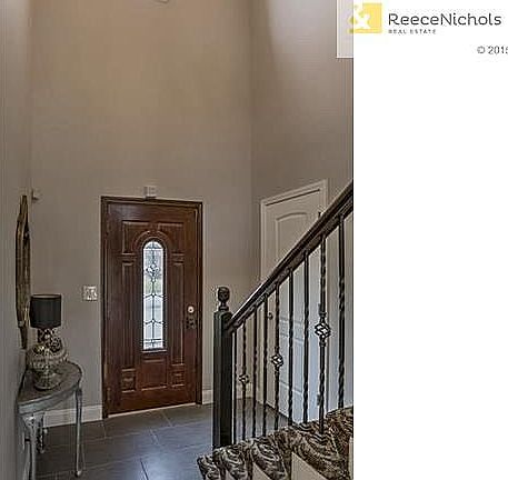 New Subway pattern tiled floors in entry, kitchen, dining room & all baths. New rot iron spindles & pattern carpet on stairway.