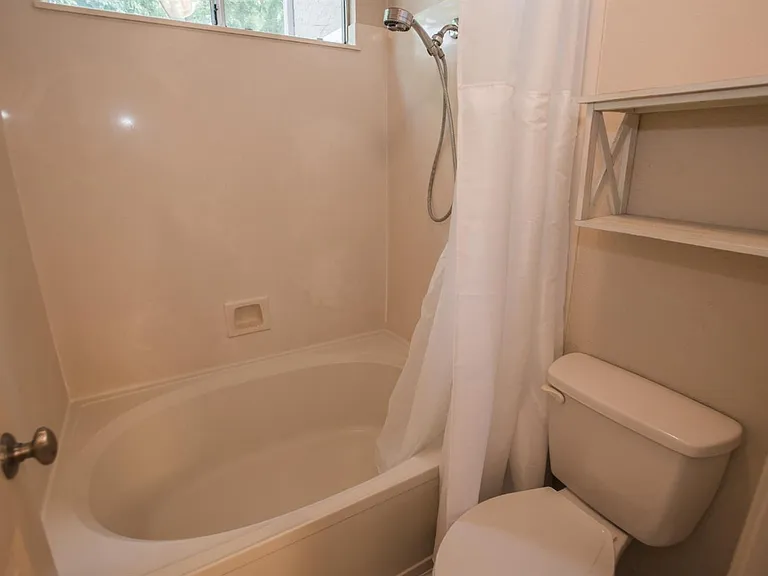 shower/bathtub and toilet in master bathroom