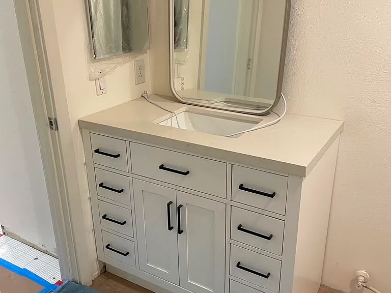 Sneak peek! New flooring and vanities being installed.