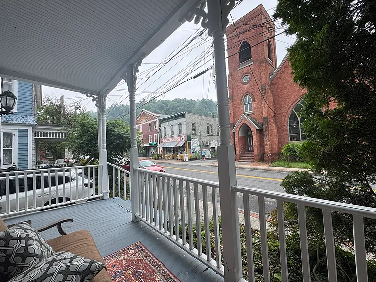 First and second floor shared porches overlook Main Street Rosendale.