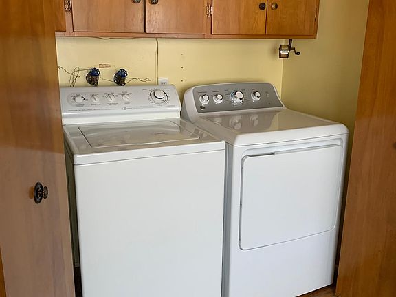 Washer and dryer located in kitchen.