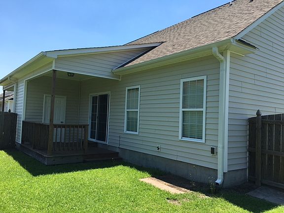 Fenced yard and covered deck