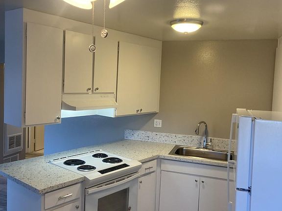 All electric kitchen, granite counter tops, full stainless steel kitchen sink. stainless steel faucet.