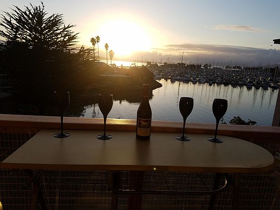 Balcony drinks as the sun sets over Alcatraz & the Golden Gate Bridge