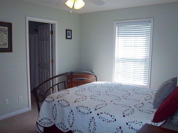 Walk-in closet along with attached bathroom