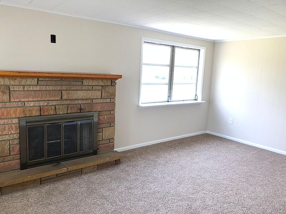 Family Room with New Carpet and Gas Fireplace