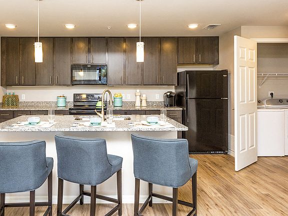 Coralina Apartments | Cape Coral, FL | Sleek Modern Kitchen with Granite Countertops
