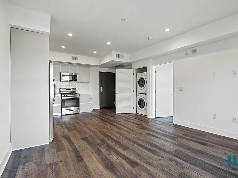 Open-Concept Kitchen, Dining, and Living Rooms with In-Suite Washer & Dryer