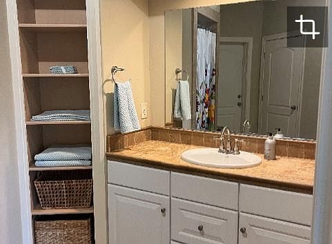 Vanity with large mirror.