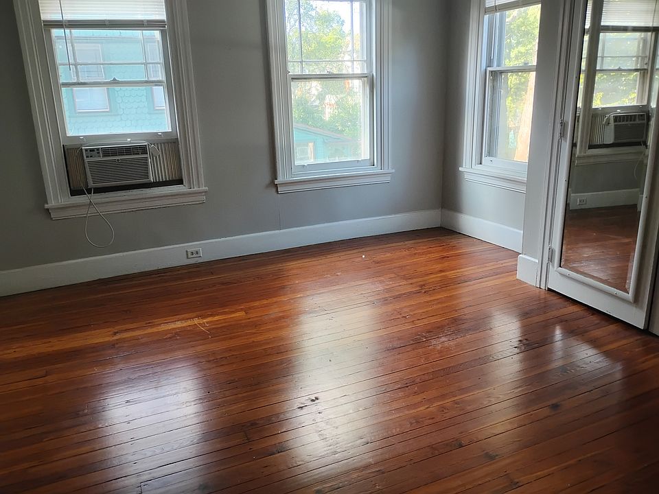 Bedroom with one AC window unit