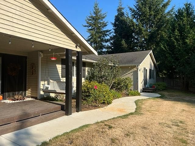 Front of house - MIL at the back (grass brown due to dry summer!) My dog featured in front of the main door.
