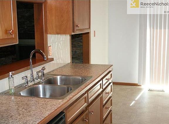 Nwer counters, sink, faucet and flooring.