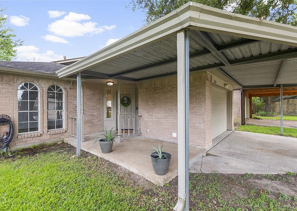 Covered carport for parking and covered entrance- so charming!