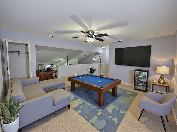 Virtually staged picture of the upstairs loft / game room