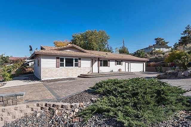 Outdoor patio with great views on left, 2-car attached garag