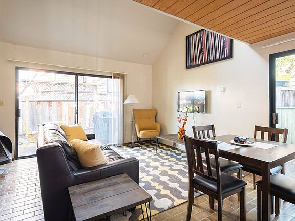 Dining area and living room (with entry to backyard off living room)
