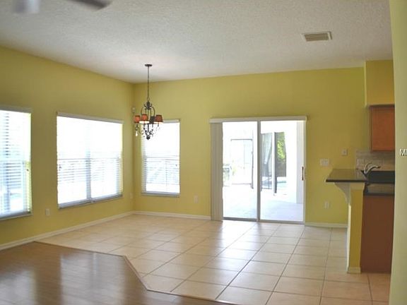 Open BREAKFAST ROOM overlooking PATIO & POOL