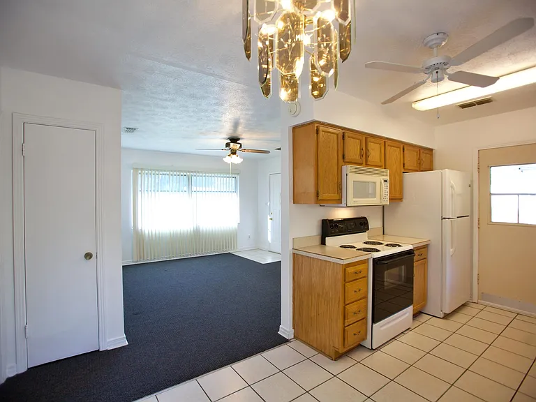 View from dining area to kitchen and living room