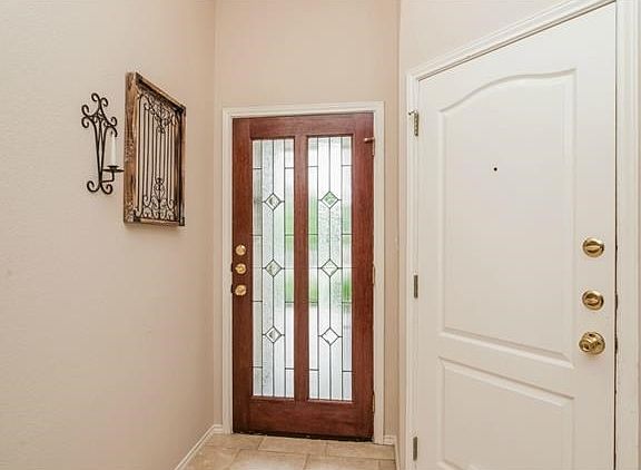 Youll find thoughtful details and decorative flourishes throughout the home. Notice the craftsmanship of the leaded glass front door and fresh designer paint throughout.
