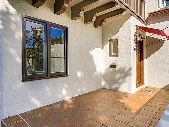 Tiled porch, perfect for a bench!