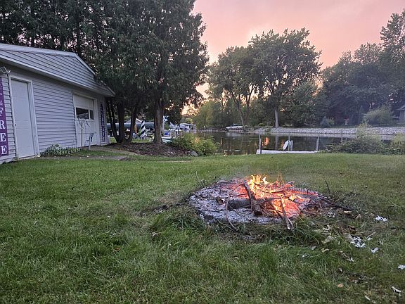 looking onto the water toward boat house and fire pit!
