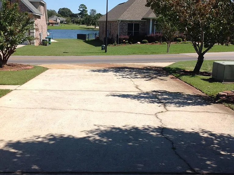 Ample parking, driveway and two car garage at property
