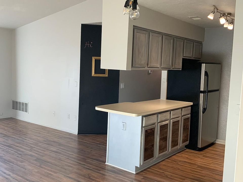 Kitchen from entrance view and chalkboard wall