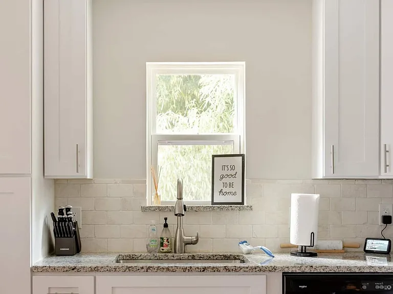 The kitchen has all the appliances: refrigerator, dishwasher, microwave, and a counter top ice machine.