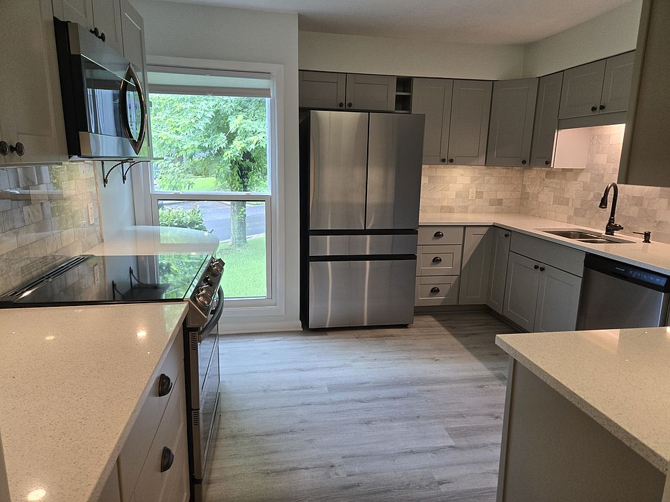 Completely renovated kitchen features all new stainless steel appliances and quartz countertops