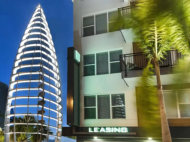 Anchor Riverwalk Building Entryway Featuring Architectural Landmark Sculpture at Night