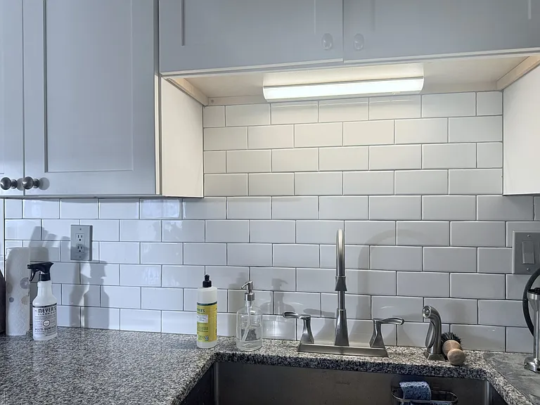 Large sink with subway title backsplash