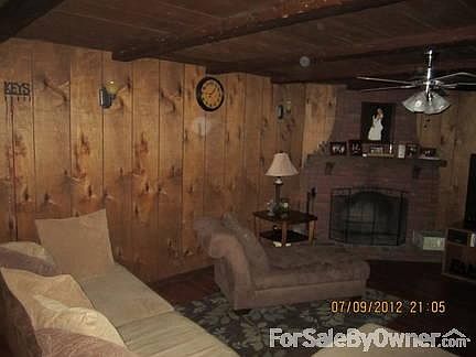 Living Room
						:
						Cozy living room with fireplace. Sliders lead out to large, fenced in back yard