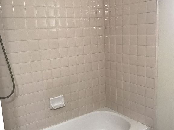 hall bath with tub and shower