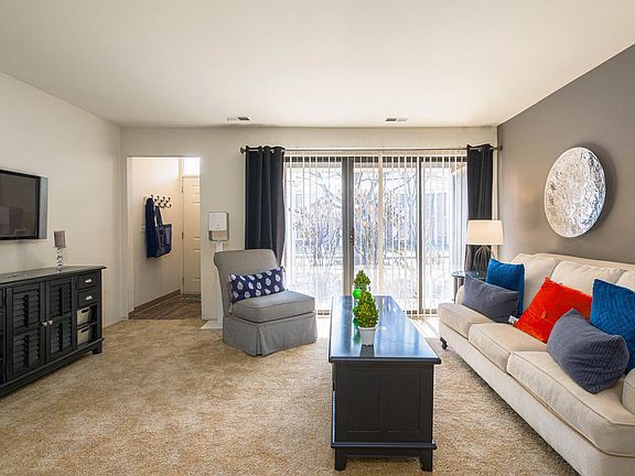 Cozy living room with natural light at Park Lane Apartments in Southfield, MI