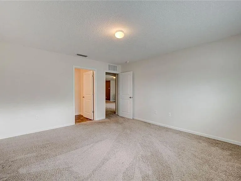Master bedroom; doorway to master bath and closet