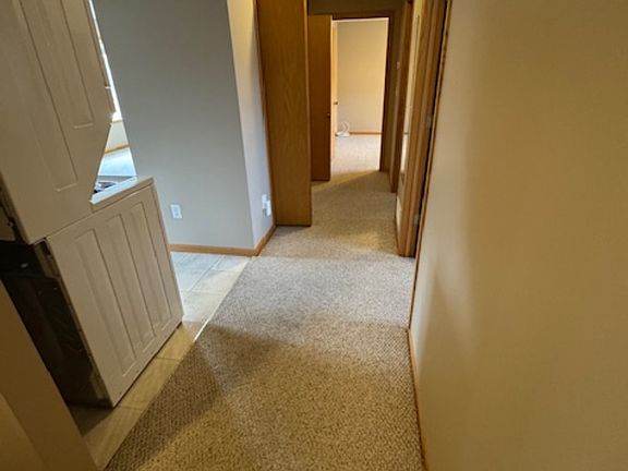 Looking from stairway down hallway
large closet in hallway across from bathroom