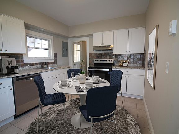 Eat in kitchen , virtually staged.