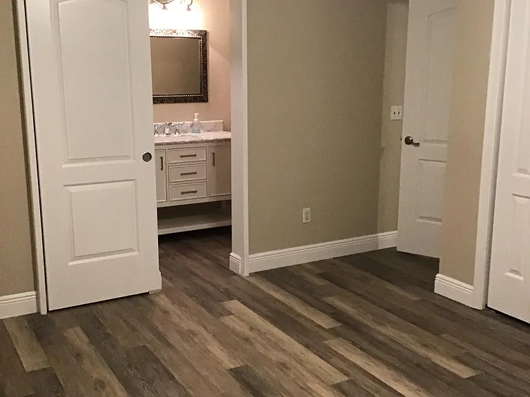 Bedroom 1 (largest), "barn door" leading to bath 1