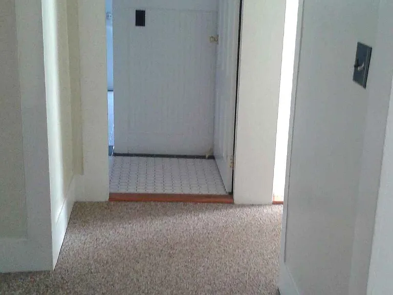 Hall running from the kitchen to the bathroom. (Not shown, to the left, is another closet. To the right is the great room.