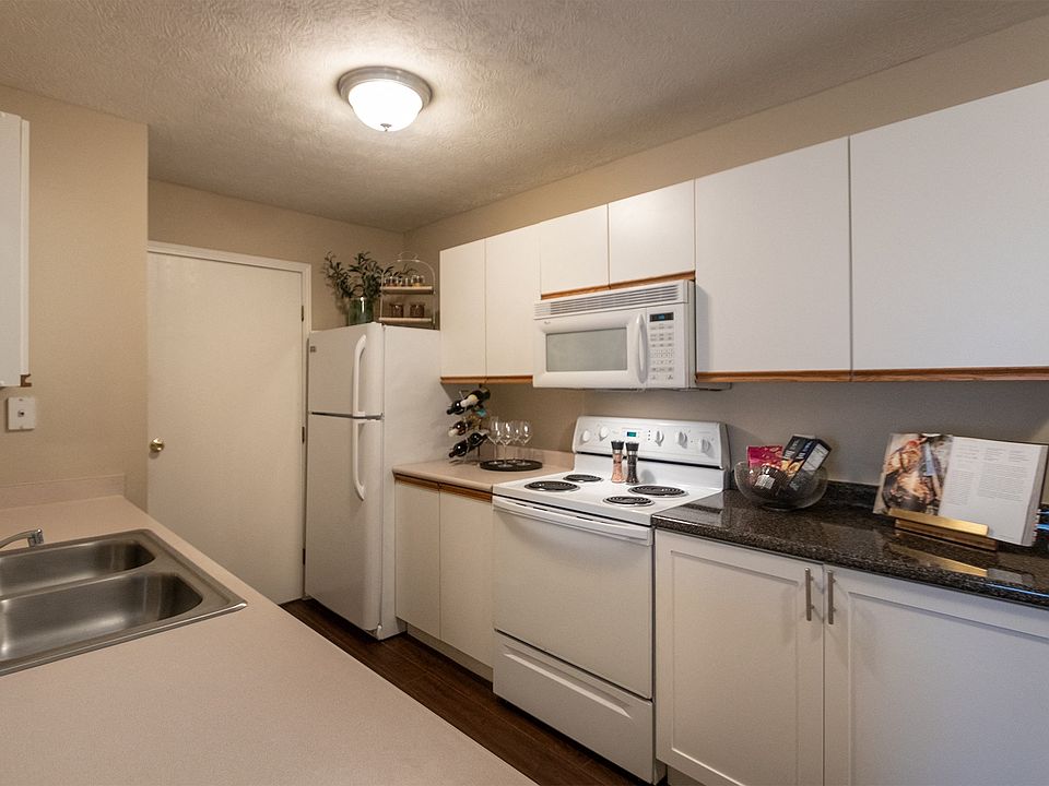 Our model Liberty kitchen features both upgraded cabinetry with dark countertops and classic cabinetry with light countertops.